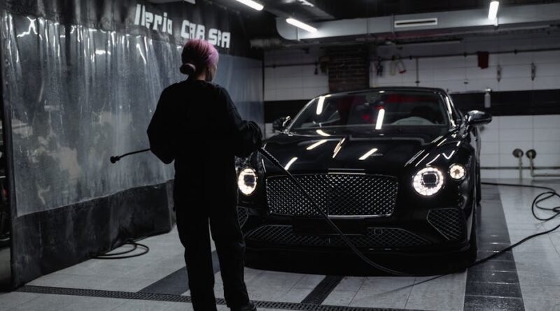 A luxury car being washed inside a car service garage by a professional. - Photo by Tima Miroshnichenko on Pexels